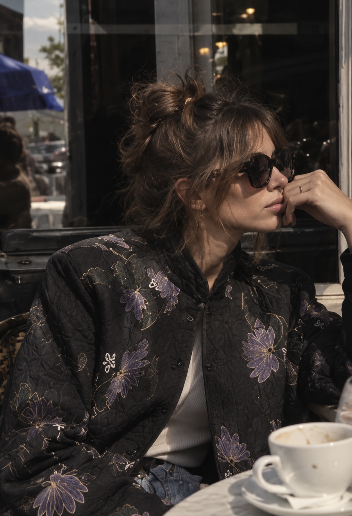 Black quilted jacket with muted floral embroidery